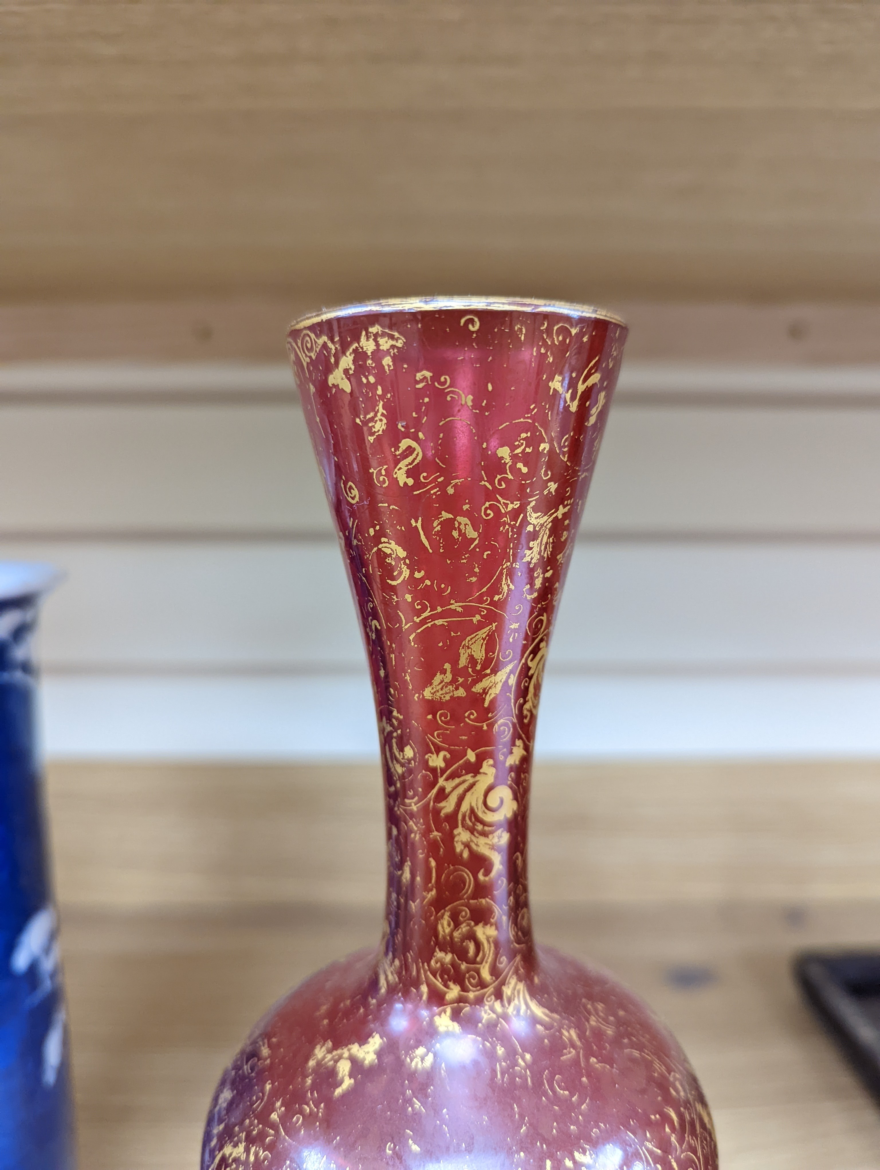 A pair of 19th century Bohemian enamelled and overlaid ruby glass vases 36cm